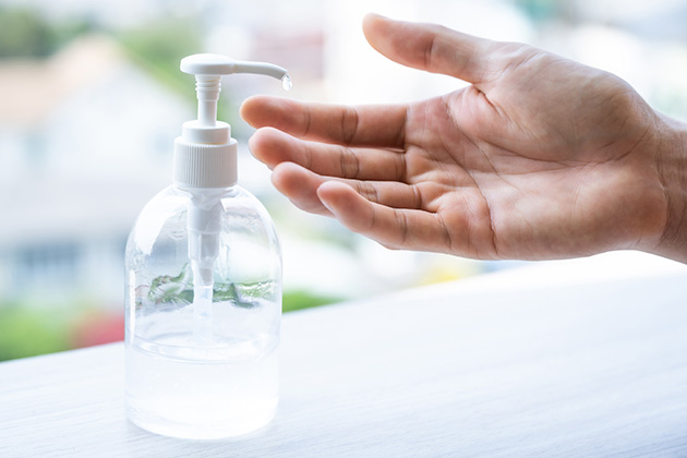 Person using hand sanitiser