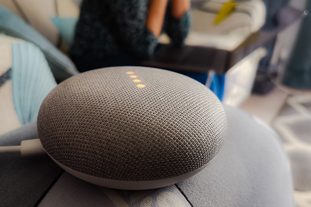 Google hub device on a sofa