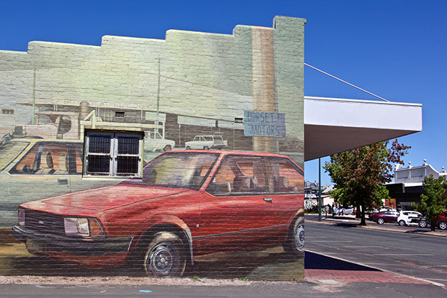 Painting of a car on a shop wall
