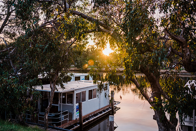 Houseboat docked at sunset