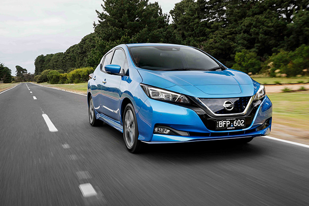 Blue electric car on road