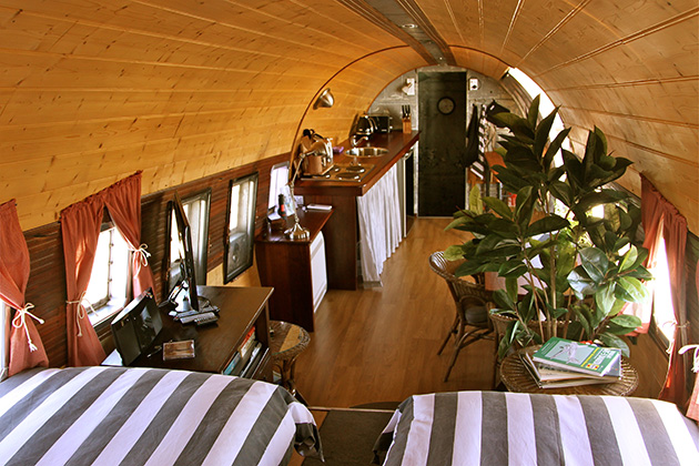 Inside of a plane with beds