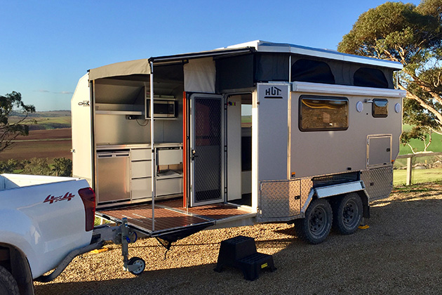 Caravan with an attached deck