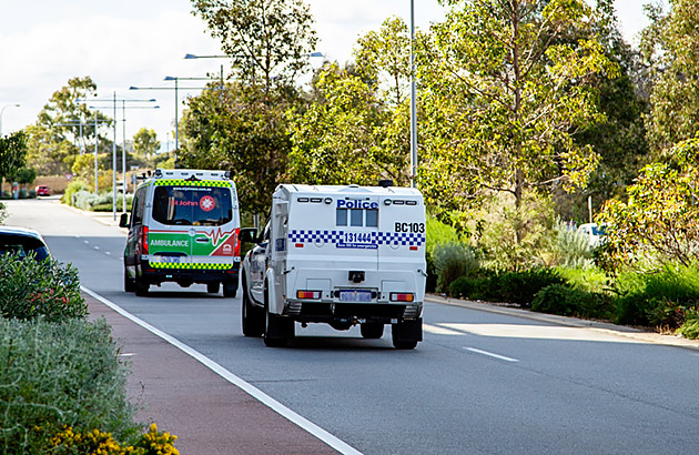 Ambulance and police on the road