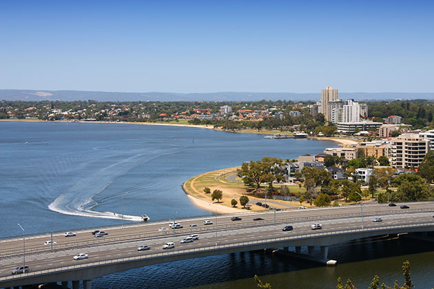 Cars crossing freeway bridge