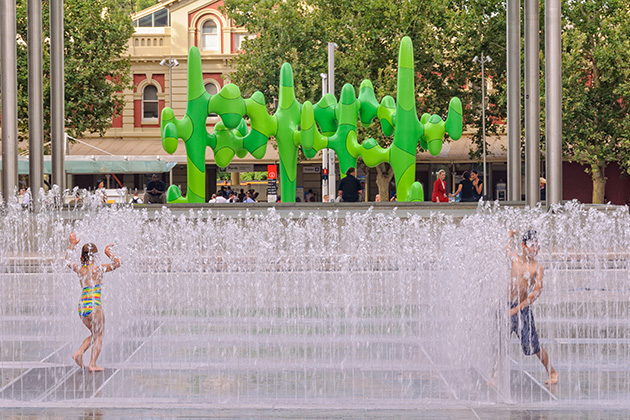 Kids playing at a water playground