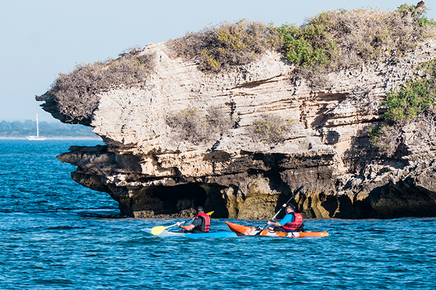 Image of two people kayaking