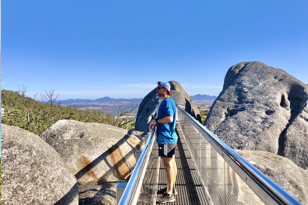 man standing on the granite skywalk lookout 