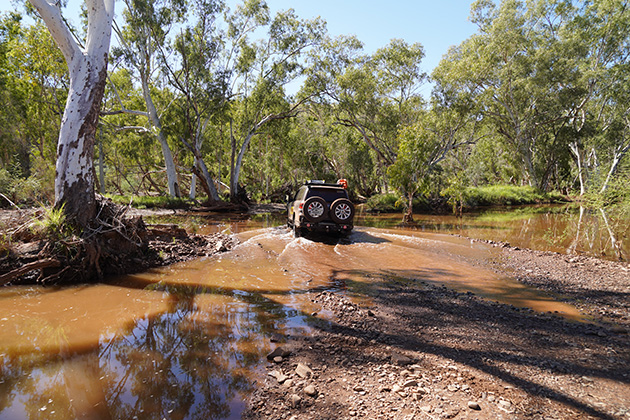 Car driving over water