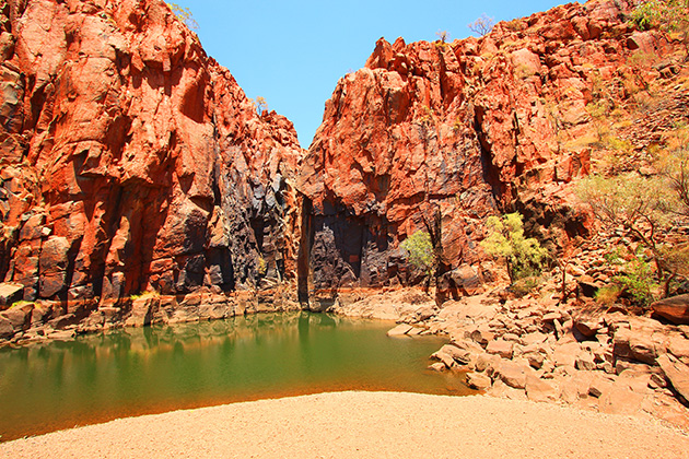 Natural pool against a red rock gorge