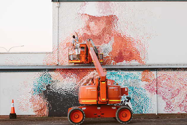 Artist painting a mural