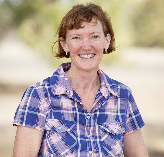 Woman in blue and purple checkered shirt