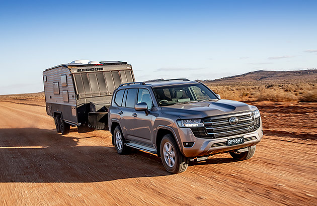 A Toyota Landcruiser 300 series towing a caravan