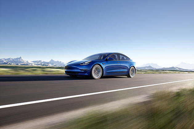 Blue Tesla car on the road