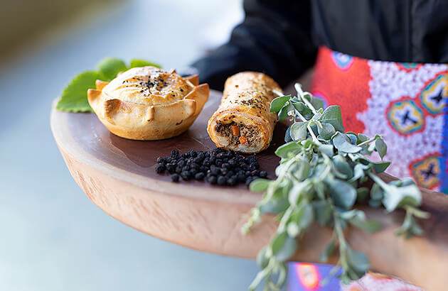 A pie and sausage roll made from bush tucker ingredients
