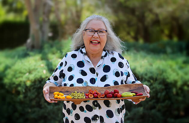 Dale Tilbrook with a plater of colourful bush foods