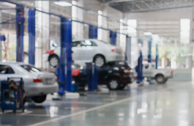 Cars in a workshop being serviced