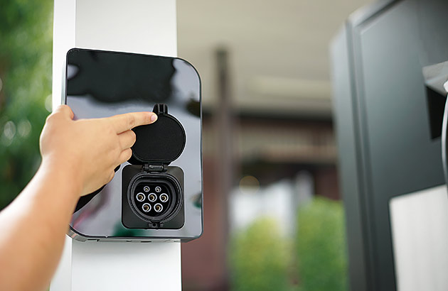 A close up of an electric car wallbox plug