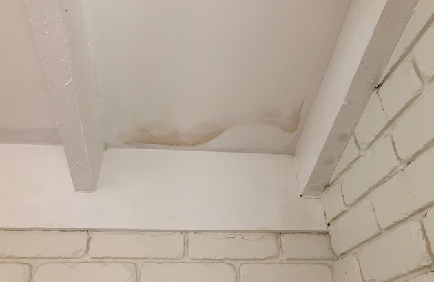 Water stains on a ceiling from a roof leak