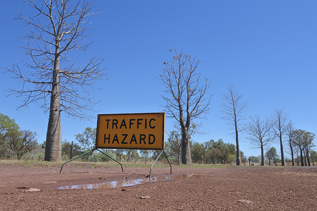 Traffic hazard sign on road