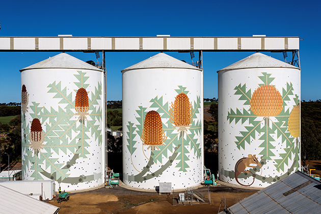 Three painted grain silos