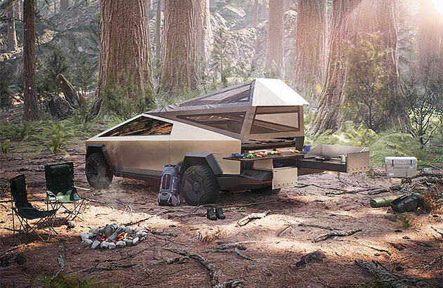 A Tesla Cybertruck electric ute in a forest campsite