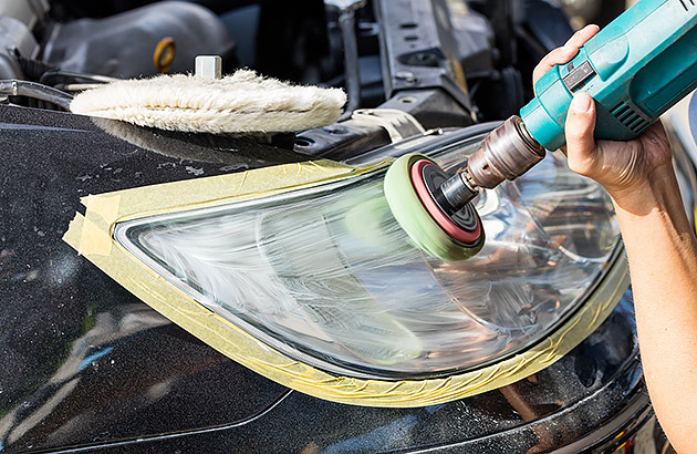 Using a headlight polishing kit on a cloudy car headlight