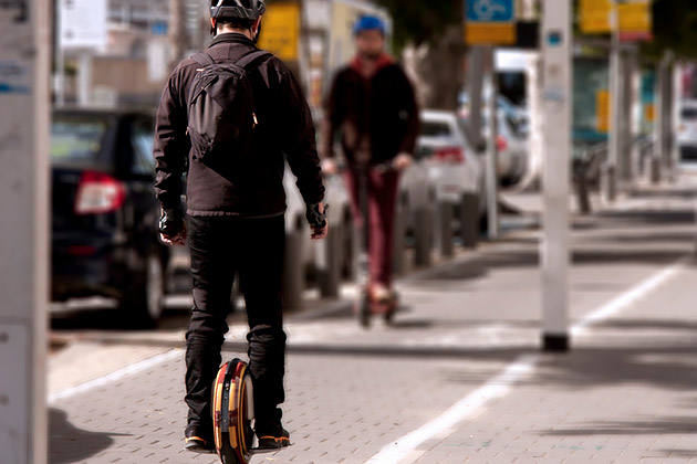 Hoverboard and e-scooter on path