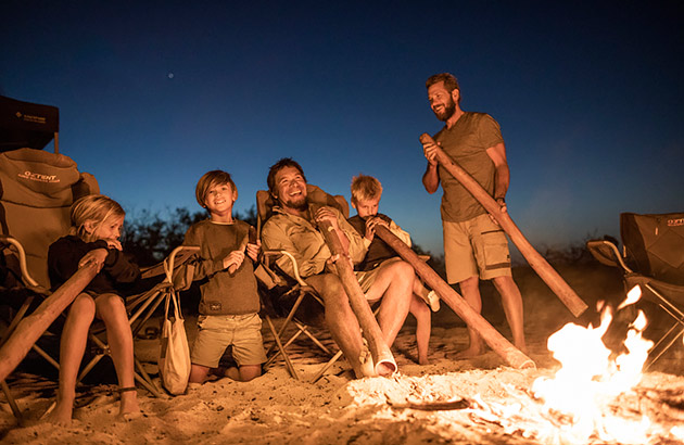 People around a campfire during a Wula Gura Nyinda Eco Adventures tour