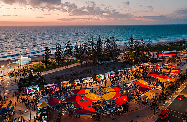 An aerial photo of the Scarborough Sunset markets at twilight