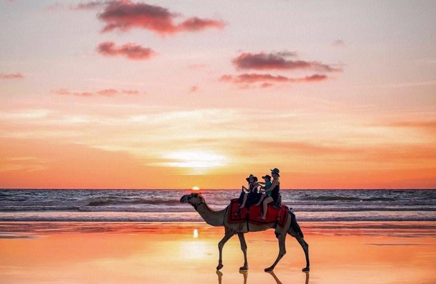 Family enjoying a Cable Beach Broome sunset camel ride