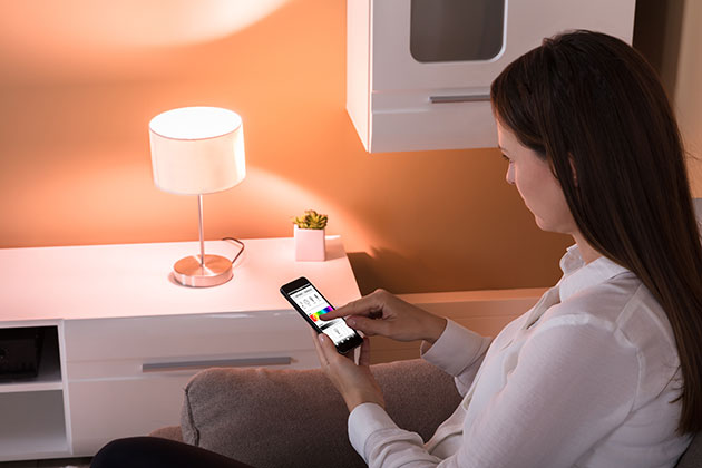 Woman using smart bulb app