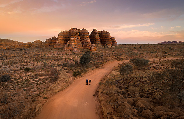 The Bungle Bungle Range with people walking in the foreground