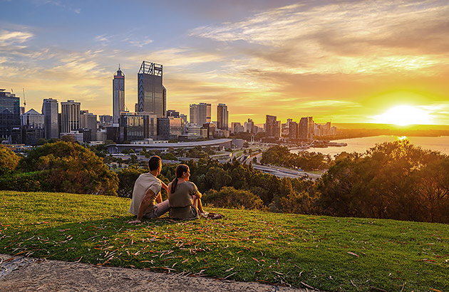 Two people sitting on the grass at Kings Park