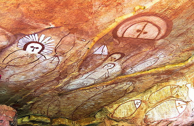 Wandjina Aboriginal Rock art paintings on a rock wall