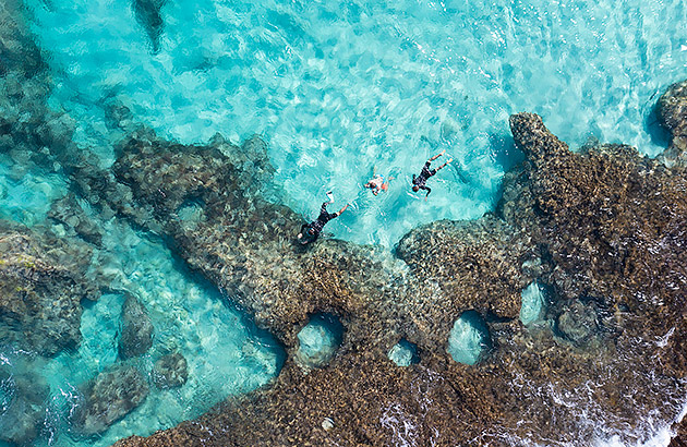 People swimming over Ningaloo Reef near Coral Bay