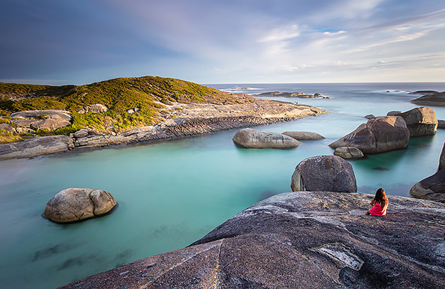 A person sitting at Elephant Rocks in William Bay National Park