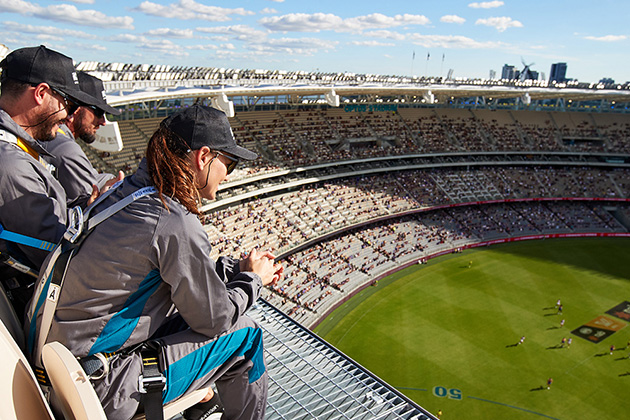 People watching football game from above