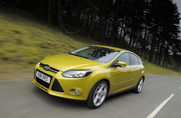 A metallic green Ford Focus