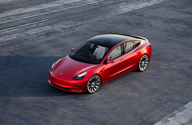 Aerial photo of a red Tesla Model 3