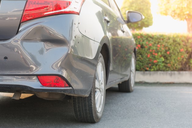 Close up of damage to back of hatchback car