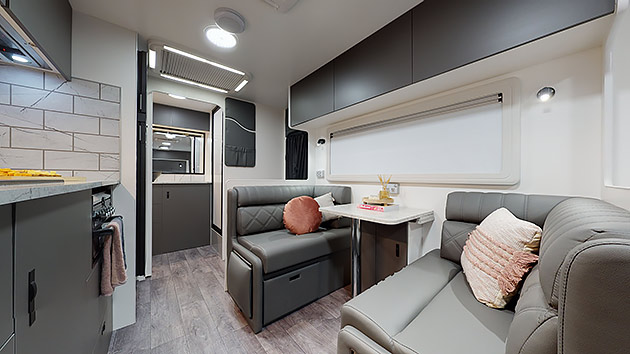 The interior of an ERV caravan showing the kitchen and dining area