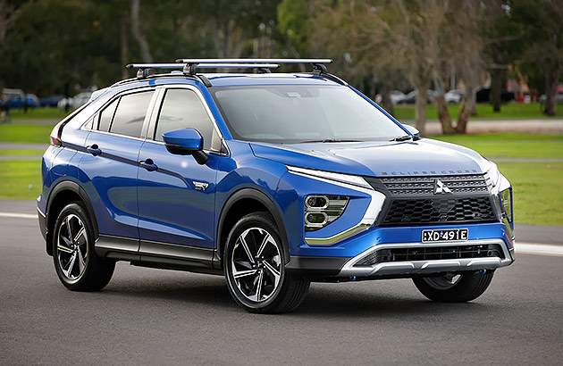 A blue Mitsubishi Eclipse Cross on a country road