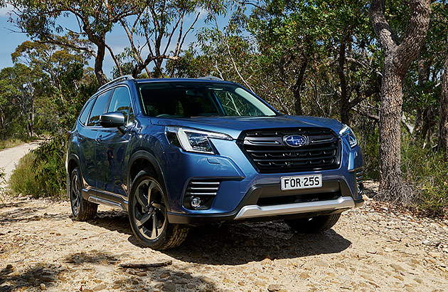 A blue Subaru Forester on a bushland track