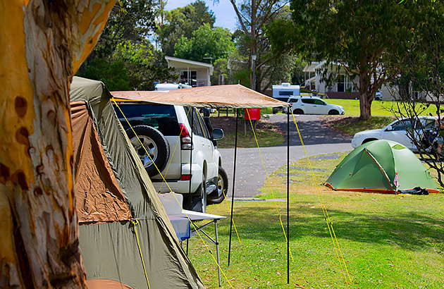 Tents on grass in caravan park