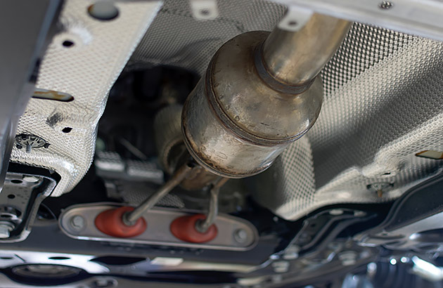 A catalytic converter under a car