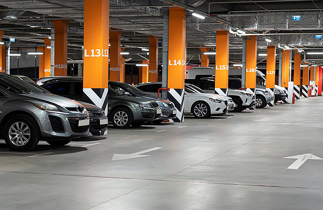 A row of cars in a multistorey car park