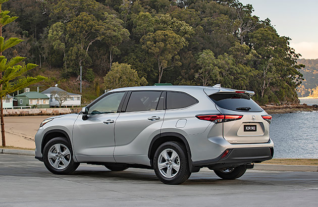 A silver Toyota Kluger GX parked near a lake