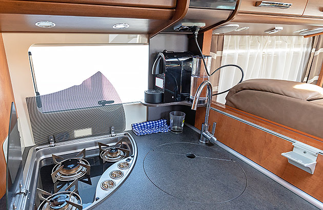 A coffee machine mounted in a caravan