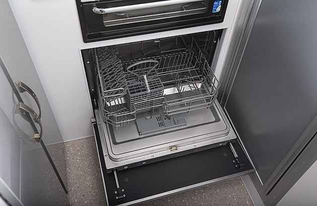 A dishwasher in a caravan kitchen area